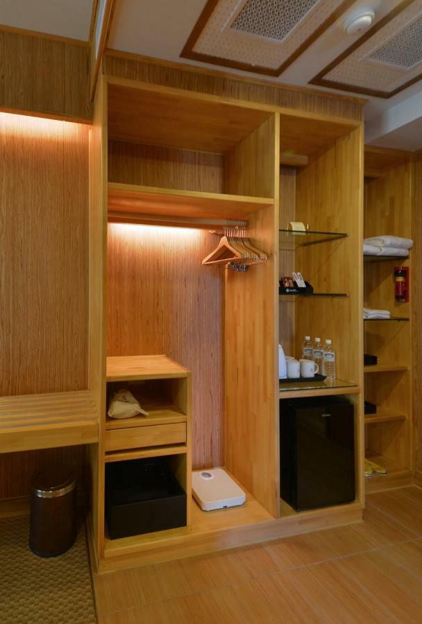 Shandori Hotel Цзяоси Экстерьер фото